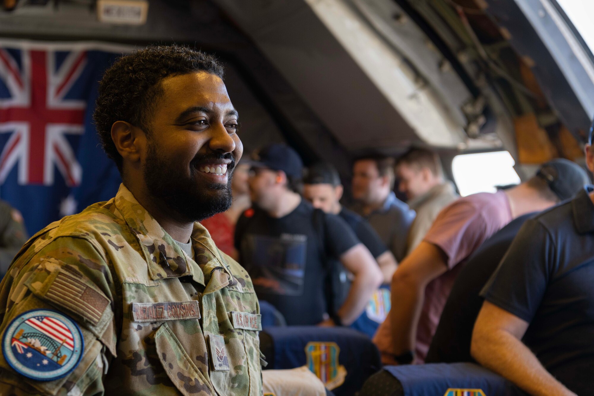 An Airman smiles interacting with visitors