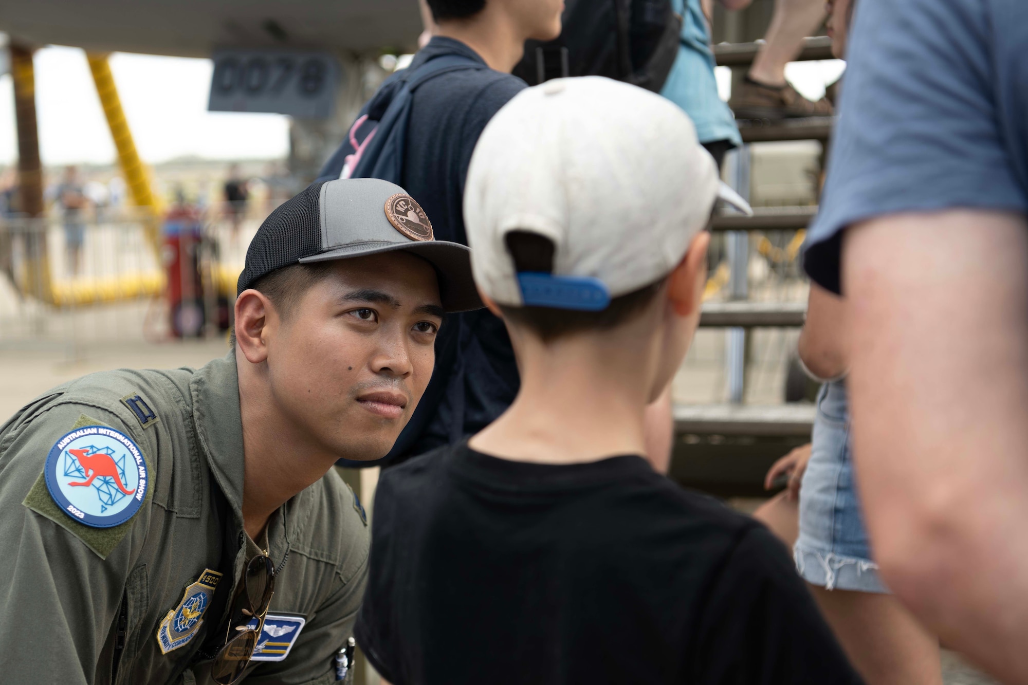 An airman talks to a child