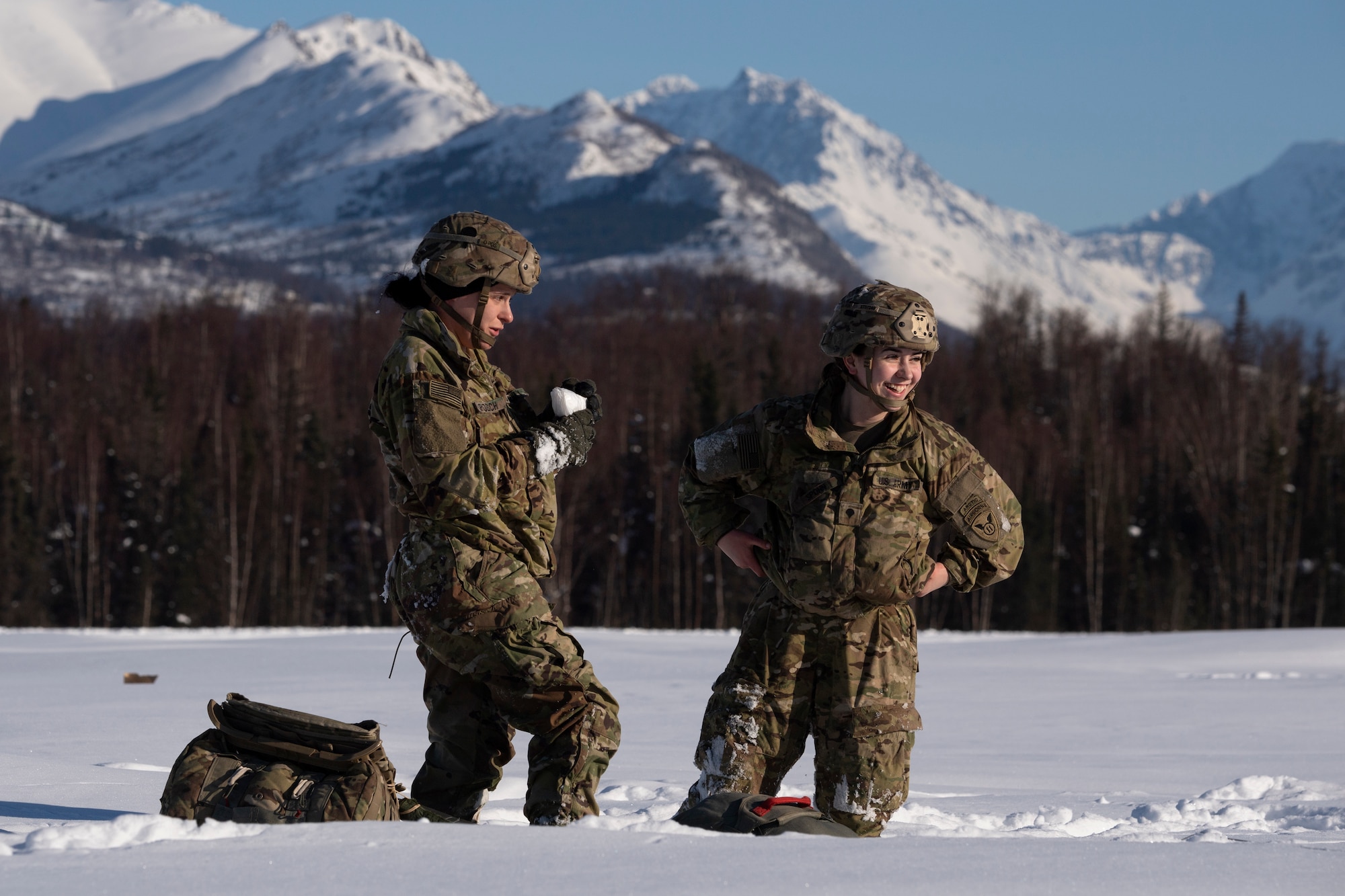 A photo of a pair of paratroopers recovering after airborne operations