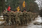 Soldiers assigned to 1st Battalion, 68th Armor Regiment, 3rd Armored Brigade, 4th Infantry Division, complete an esprit de corps run with Latvian soldiers assigned to the Latvian Land Forces Infantry Brigade, Feb. 17, 2017 at Camp Adazi, Latvia.