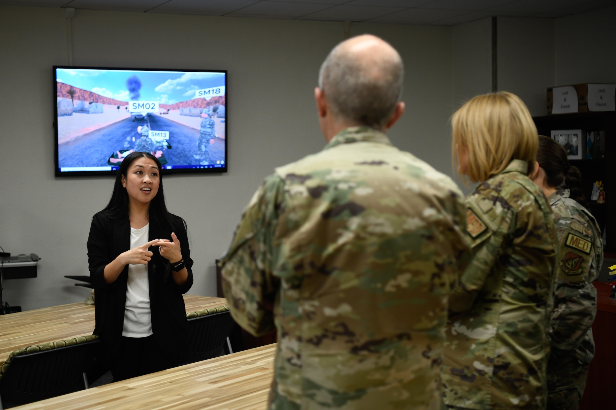 A staff member briefs service members on topic.