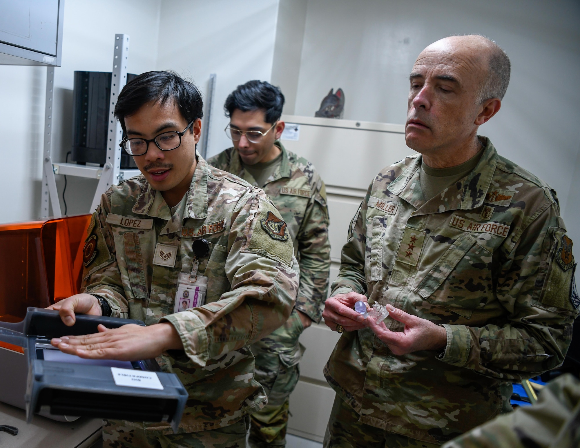 SSgt Lopez shows Lt. Gen. Miller dental technology.