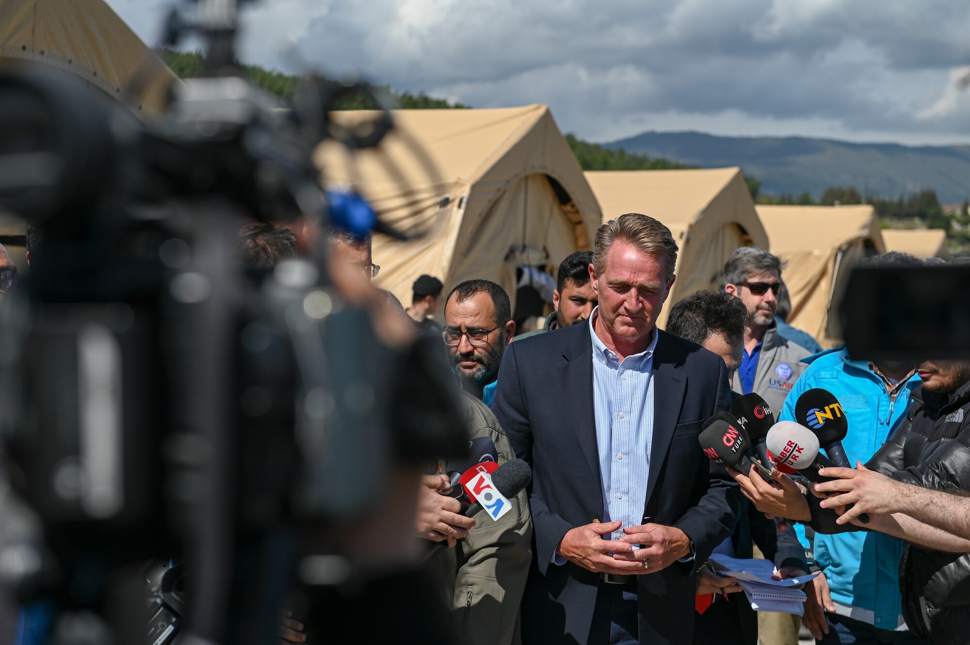 Ambassador Jeffry Flake, U.S. Ambassador to Türkiye, prepares for a press conference at the field hospital on the grounds of Mustafa Kemal University Hospital in Serinyol, Hatay, Türkiye, March 7, 2023.