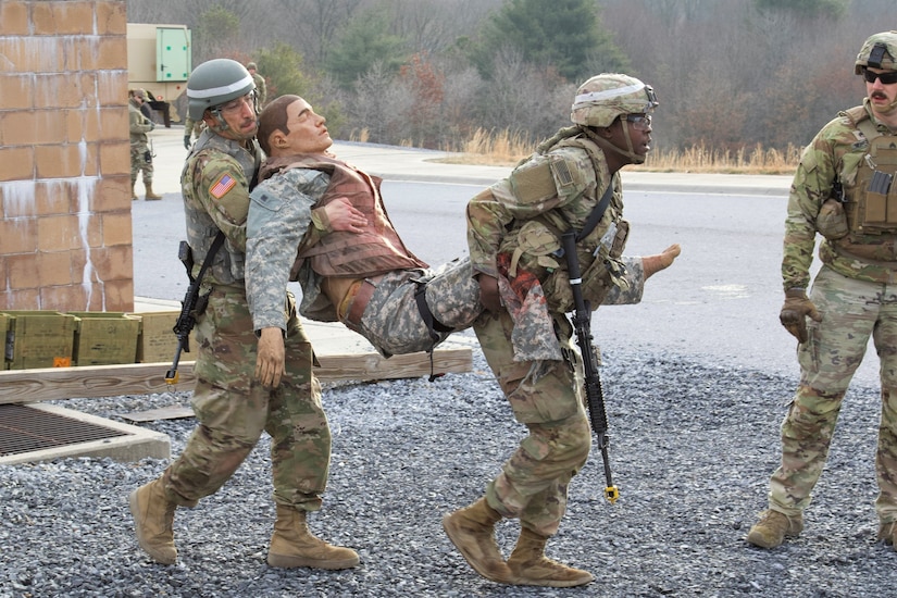 U.S. Soldiers evacuate a simulated casualty during an exercise at the Combined Arms Collective Training Facility at Fort Indiantown Gap, March 3, 2023. This exercise included responding to the scene of a mass casualty event, providing first aid and evacuating the simulated casualties to a field hospital where they received further care, all while being assessed by instructors with the Pennsylvania National Guard’s 4th Battalion, 166th Regiment Regional Training Institute (Medical Battalion Training Site). (U.S. Army National Guard photo by Maj. Travis Mueller)