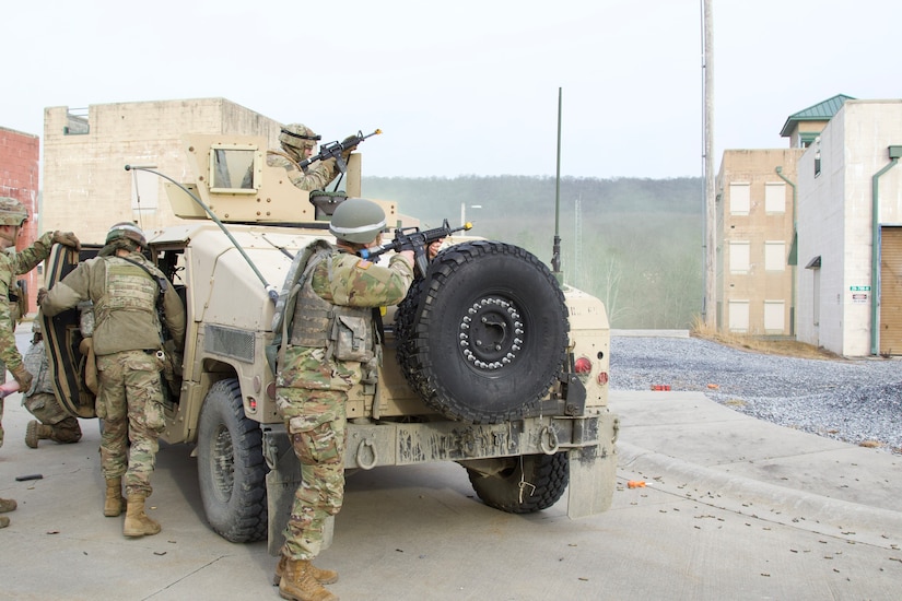 U.S. Soldiers provide security to a team of medic trainees responding to a simulated mass casualty event at the Combined Arms Collective Training Facility at Fort Indiantown Gap, March 3, 2023. This exercise included responding to the scene of the event, providing first aid and evacuating the simulated casualties to a field hospital where they received further care, all while being assessed by instructors with the Pennsylvania National Guard’s 4th Battalion, 166th Regiment Regional Training Institute (Medical Battalion Training Site). (U.S. Army National Guard photo by Maj. Travis Mueller)