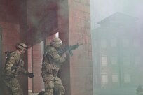 A U.S. Soldier provides security to a team of combat medic trainees responding to a simulated mass casualty event at the Combined Arms Collective Training Facility at Fort Indiantown Gap, March 3, 2023. This exercise included responding to the scene of the event, providing first aid and evacuating the simulated casualties to a field hospital where they received further care, all while being assessed by instructors with the Pennsylvania National Guard’s 4th Battalion, 166th Regiment Regional Training Institute (Medical Battalion Training Site). (U.S. Army National Guard photo by Maj. Travis Mueller)
