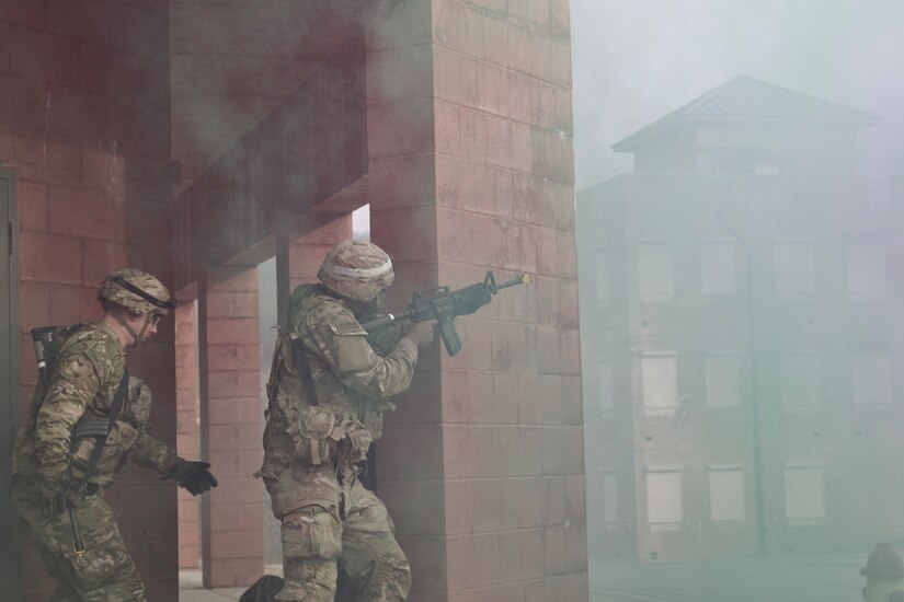 A U.S. Soldier provides security to a team of combat medic trainees responding to a simulated mass casualty event at the Combined Arms Collective Training Facility at Fort Indiantown Gap, March 3, 2023. This exercise included responding to the scene of the event, providing first aid and evacuating the simulated casualties to a field hospital where they received further care, all while being assessed by instructors with the Pennsylvania National Guard’s 4th Battalion, 166th Regiment Regional Training Institute (Medical Battalion Training Site). (U.S. Army National Guard photo by Maj. Travis Mueller)