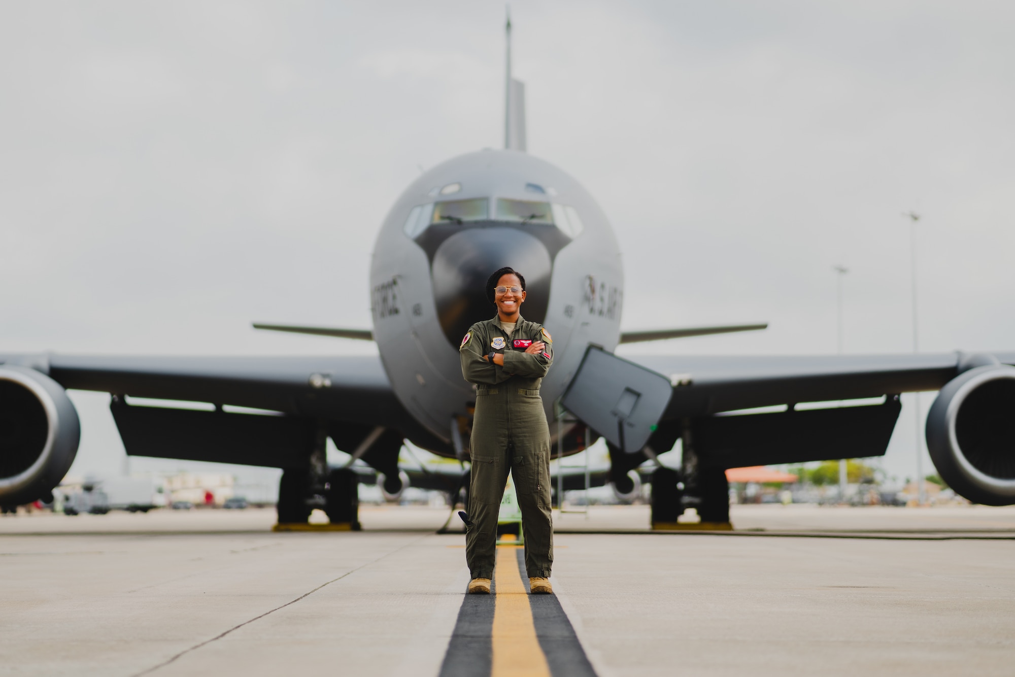 U.S. Air Force Capt. Orchydia Sackey, 50th Air Refueling Squadron pilot, stands in front of a KC-135 Stratotanker aircraft at MacDill Air Force Base, Florida, March 7, 2023.