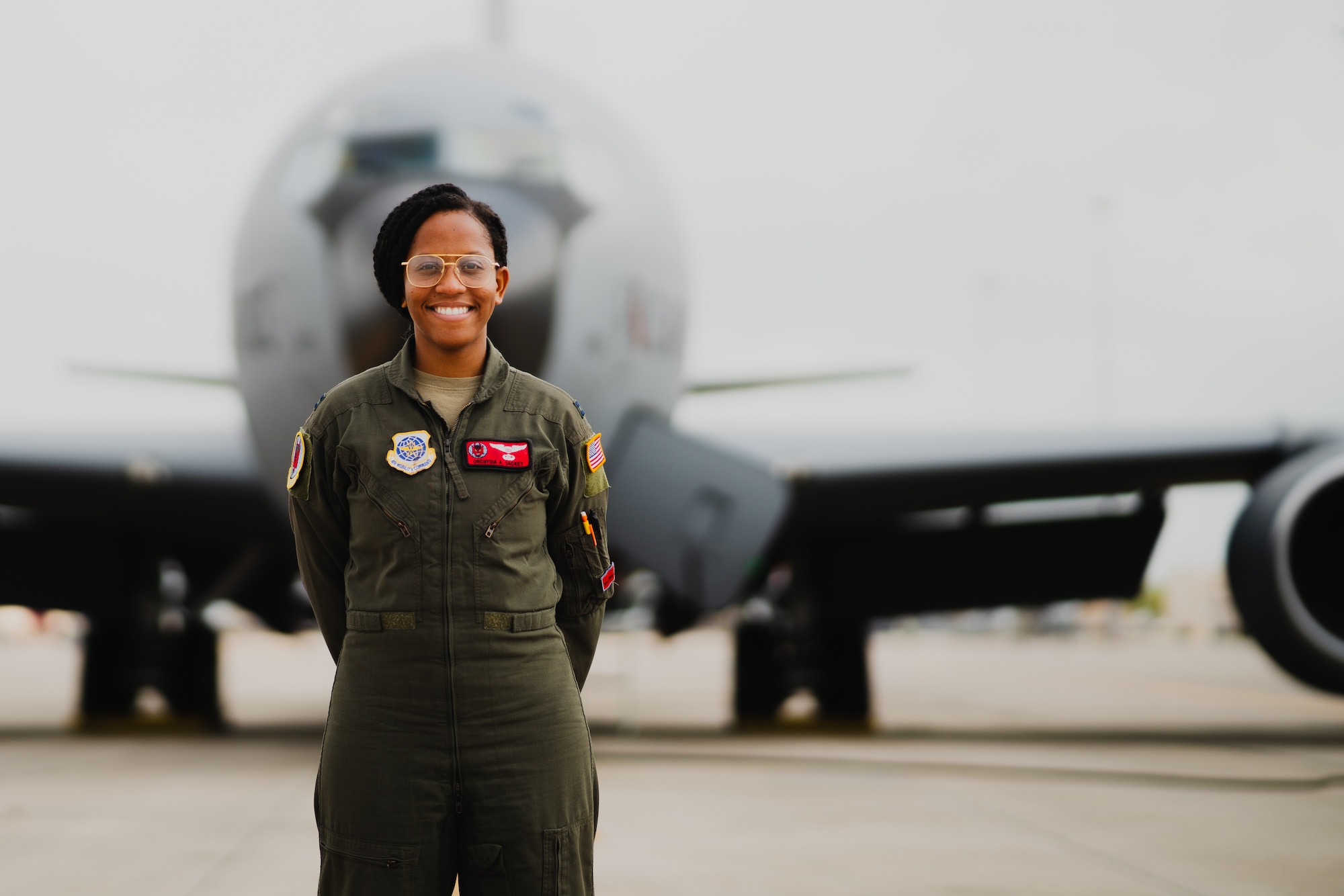 U.S. Air Force Capt. Orchydia Sackey, 50th Air Refueling Squadron pilot, stands in front of a KC-135 Stratotanker aircraft at MacDill Air Force Base, Florida, March 7, 2023.