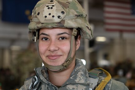 A photo of a female paratrooper smiling at the camera