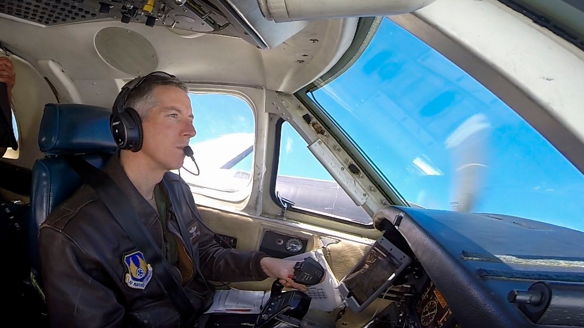Col. Grant Mizell, Commander, 412th Operations Group pilots the C-12 Huron during the Sidewinder low level flight survey through the Southern California wilderness.