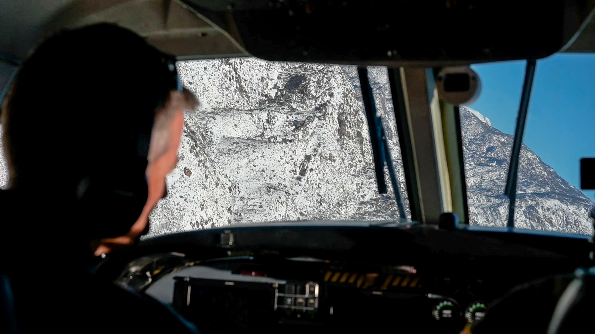 Col. Grant Mizell, Commander, 412th Operations Group pilots the C-12 Huron during the Sidewinder low level flight survey through the Southern California wilderness.