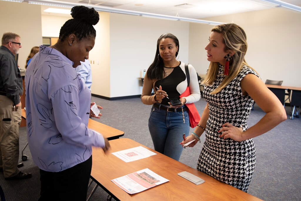 Dellaria Martin (Left), U.S. Army Corps of Engineers Nashville District contracting officer, answers questions and provides information to Allie Williamson (Right), chief executive diva for Southern Domestic Diva, and Laina Kimbro, sales executive assistant, during the U.S. Army Corps of Engineers Nashville District’s Small Business Industry Day March 6, 2023, at Tennessee State University in Nashville, Tennessee. (USACE Photo by Lee Roberts)