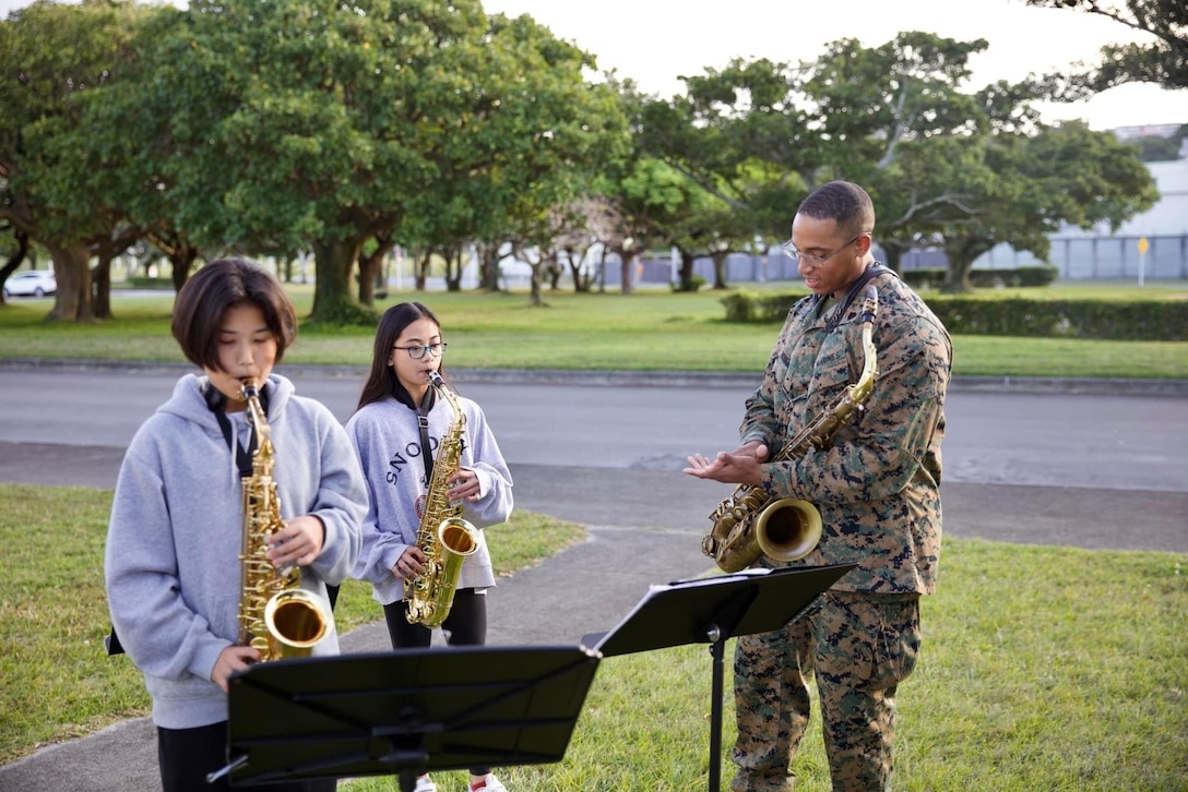 U.S. Marine Sgt Erik Wright, a saxophonist in the III Marine Expeditionary Force Band, conducts sectionals with students of the Lester Middle School Band. The Marines of the III MEF Brass Band performed for music students to kick off “Music in Our Schools” Month at Camp Lester in Okinawa, Japan.