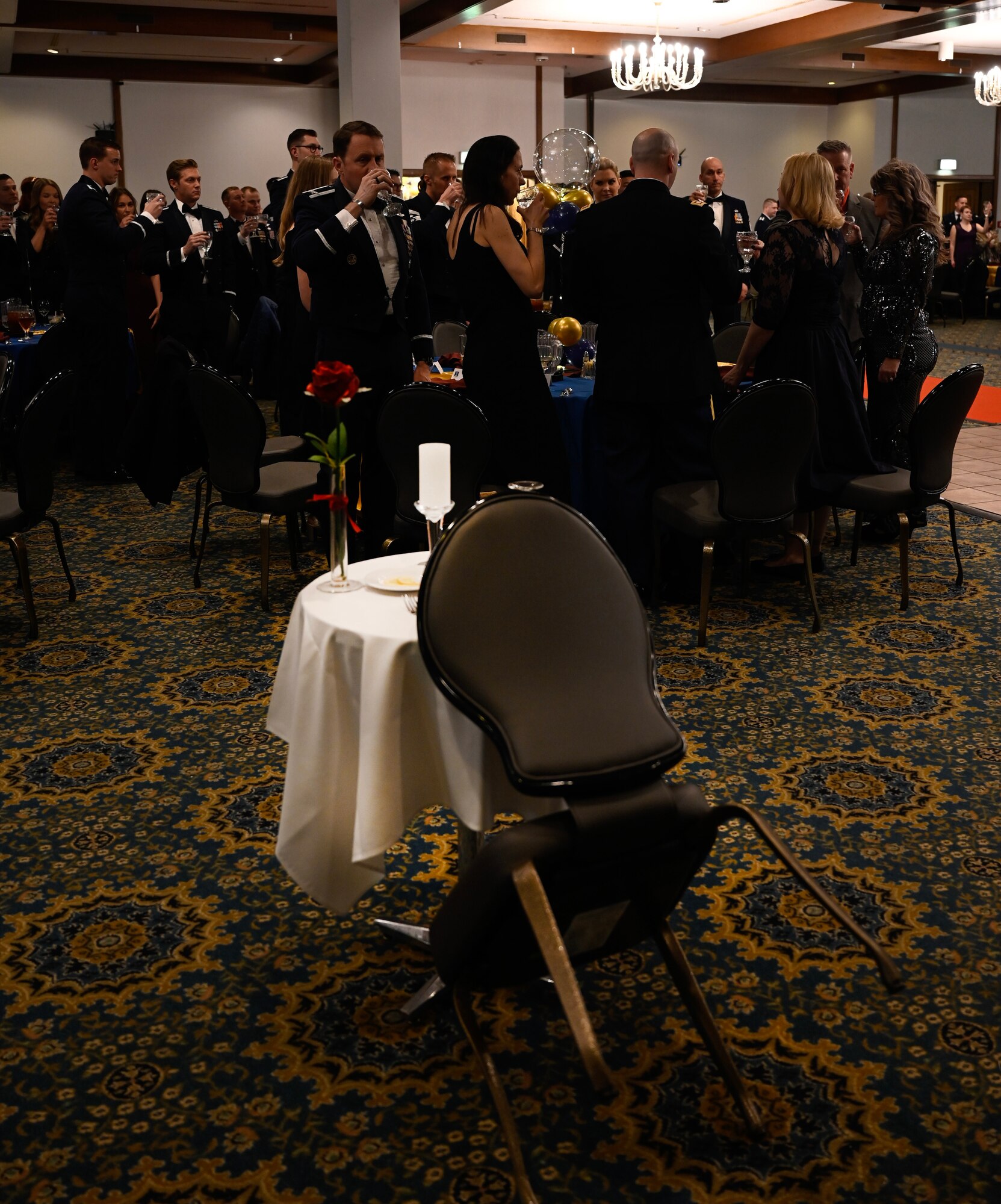 Members of the 435th Air Ground Operations Wing participated in a silent toast for  Prisoners of War and those Missing in Action during the wing’s annual award ceremony at Ramstein Air Base, Germany, March 4, 2023. The tradition of setting a separate table in honor of prisoners of war and missing comrades has been in place since the end of the Vietnam War.