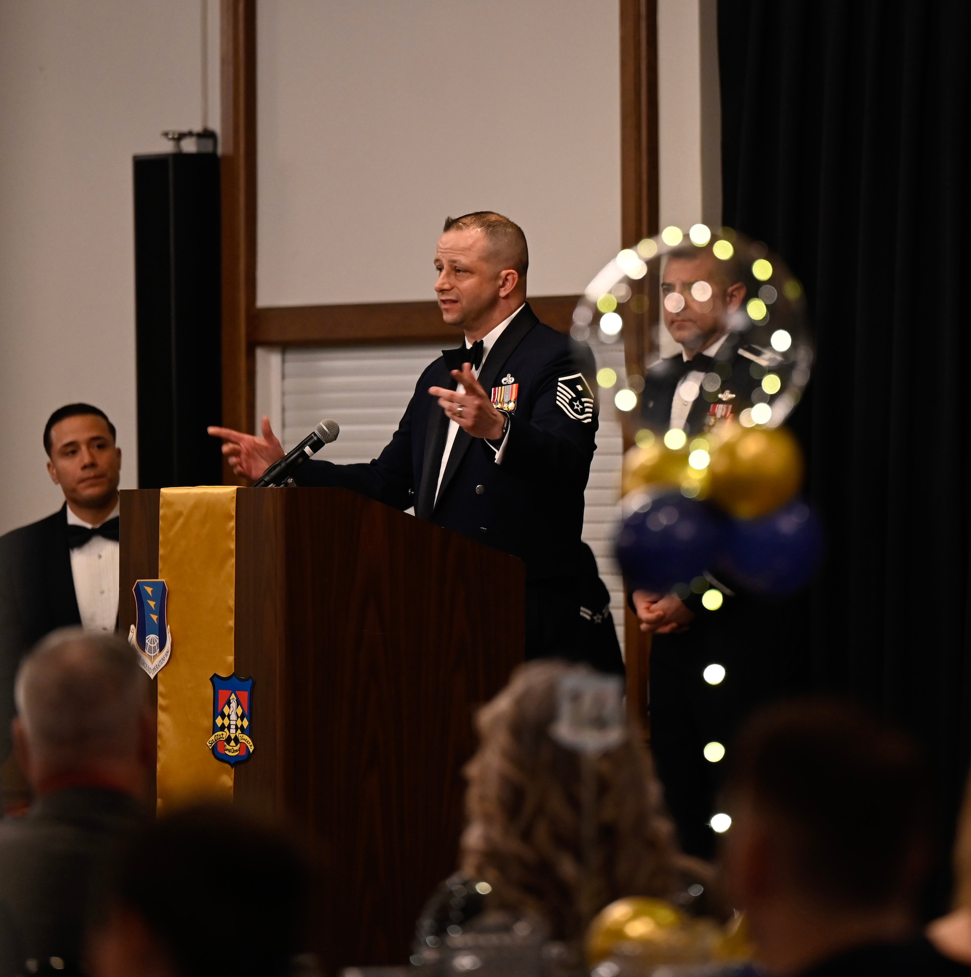 U.S. Air Force Master Sgt. Jason Skaradzinski, 1st Communications Maintenance Squadron first sergeant, speaks to audience members during the wing’s annual awards and 80th Anniversary ceremony at Ramstein Air Base, Germany, March 4, 2023. Skaradzinski, along with several other personnel, planned the event to showcase the unit’s distinguished performance during the year.