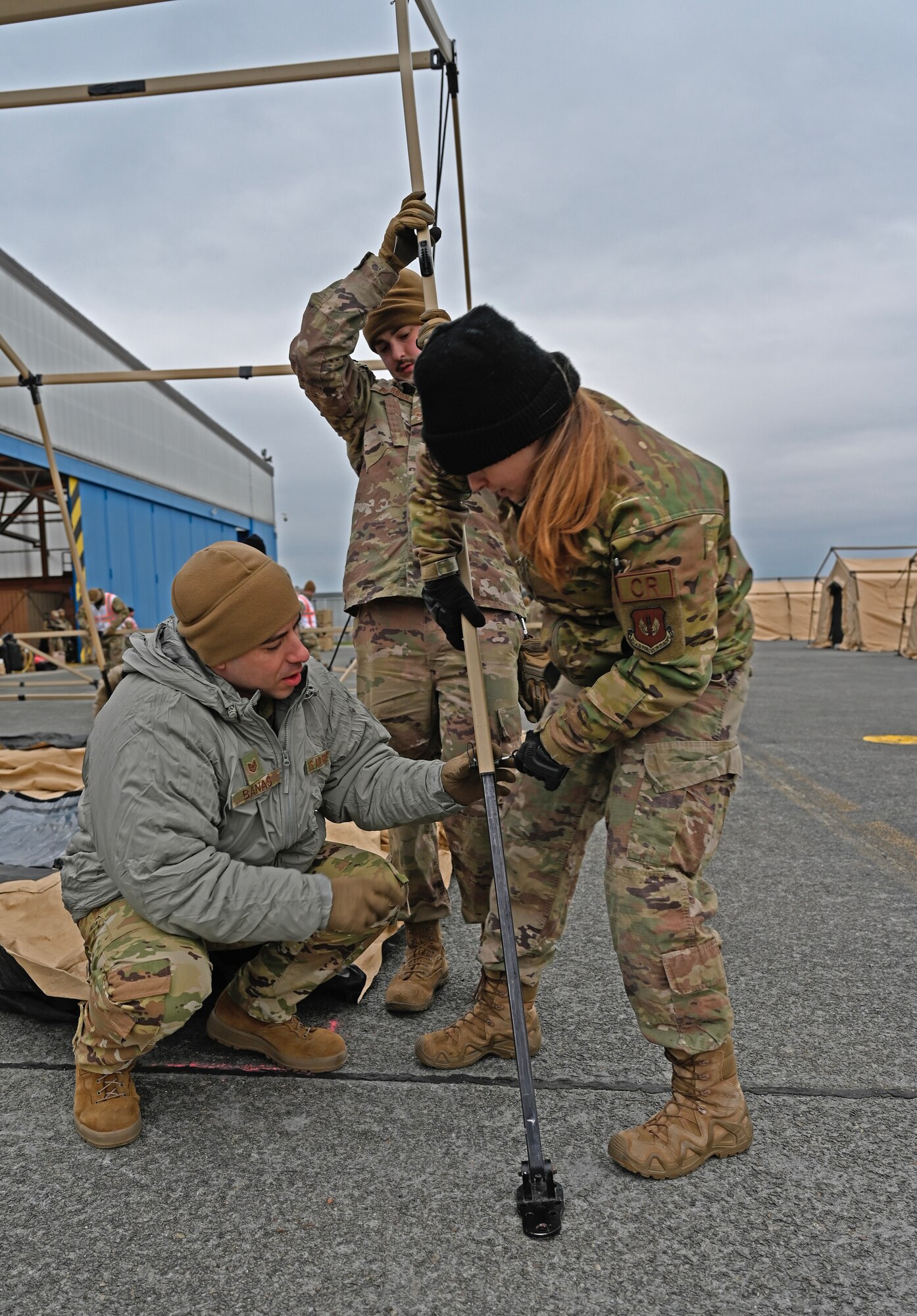 Members of the 435th Contingency Response Group begin Exercise Agile Bison 23-1 by building tents at Chièvres Air Base, Belgium, March 6, 2023. The team will execute contingency responses, construction and expeditionary training while building partnerships with NATO allies.
