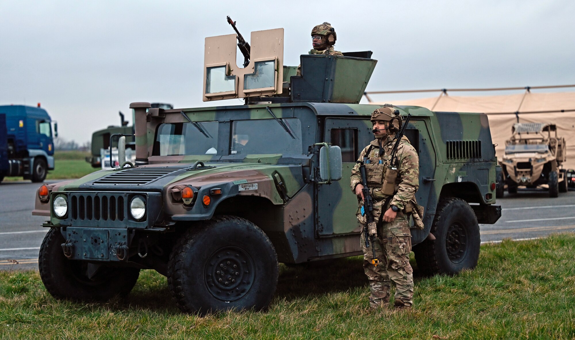 U.S. Air Force Staff Sgts. Mason E-Quantay, top, and Jesus Solis-Zavala, right, both 435th Security Forces Squadron contingency response team members, provide security during Exercise Agile Bison 23-1 at Chièvres Air Base, Belgium, March 7, 2023. By executing Exercise Agile Bison, the 435th Contingency Response Group boosts their confidence, flexibility and capability to assist and work with allied and partner nations.