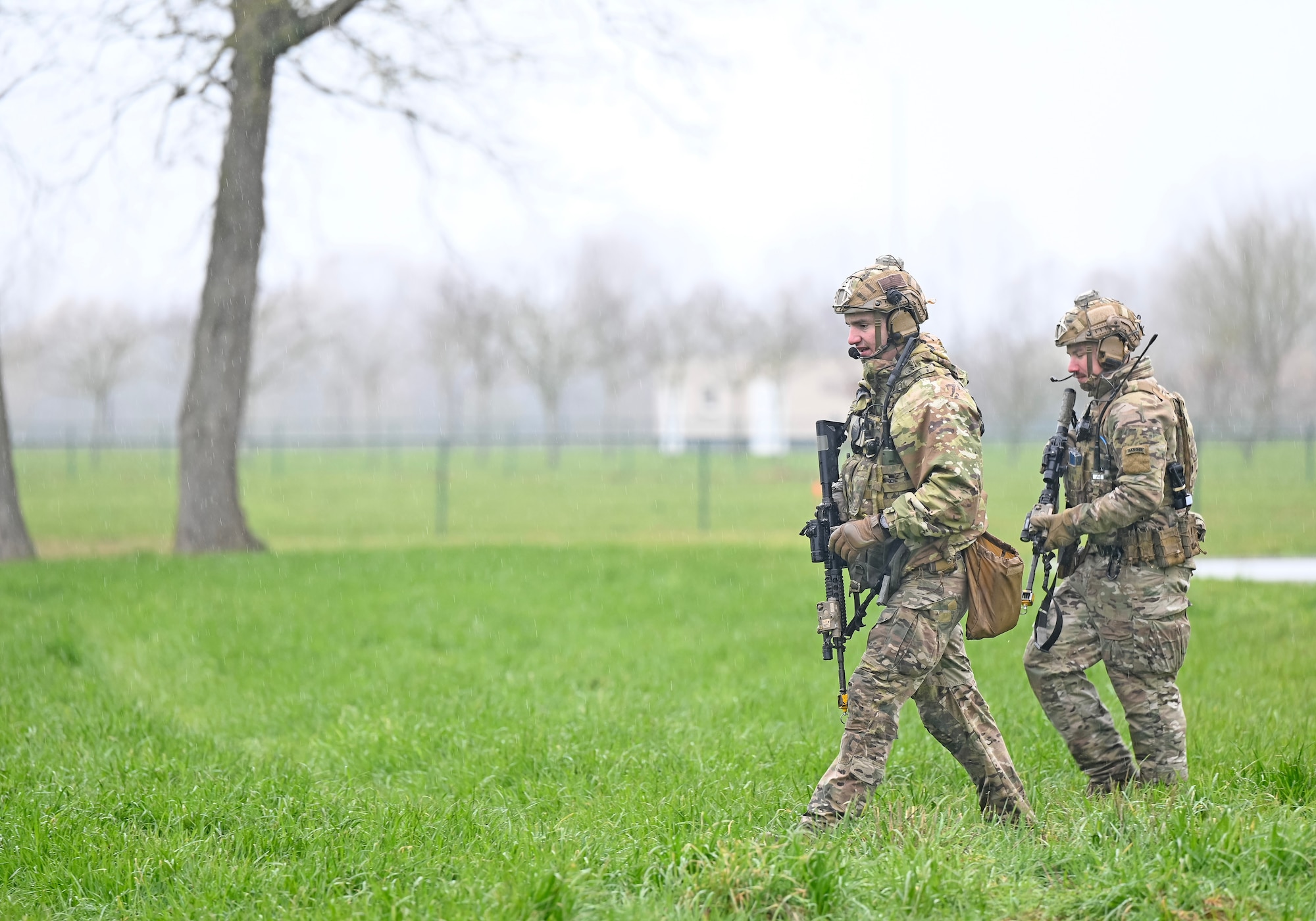U.S. Air Force Tech. Sgt. Tyler Karr, left, and Staff Sgt. Jose Gonzalez, right, 435th Security Forces Squadron team members complete a mission objective as part of Exercise Agile Bison 23-1 at Chièvres Air Base, Belgium, March 7, 2023. The four-man team’s mission was to assault the objective, which begins when the team places direct and indirect fire on an enemy.