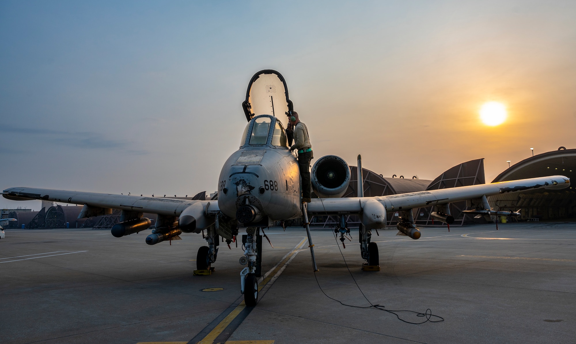 U.S. Air Force Airman 1st Class Timothy Gisclair, 25th Fighter Generation Squadron crew chief, performs pre-flight checks on an A-10C Thunderbolt II during Buddy Squadron 23-2 at Osan Air Base, Republic of Korea, March 8, 2023.