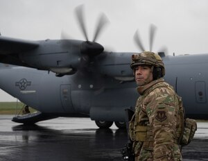 U.S. Air Force Master Sgt. Hector Gonzalez, 435th Air Ground Operations Wing productions superintendent, waits for his team to perform an engine running onload procedure on a C-130J Super Hercules cargo aircraft assigned to Ramstein Air Base, Germany, during Exercise Agile Bison at Chièvres Air Base, Belgium, March 9, 2023.