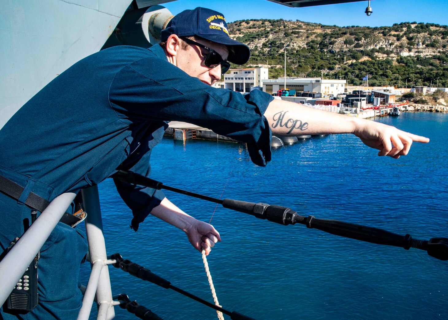 (March 10, 2023) Boatswain’s Mate 1st Class Alexander Padworski, assigned to the Nimitz-class aircraft carrier USS George H.W. Bush (CVN 77), directs Sailors as the ship, along with the embarked staff of Carrier Strike Group (CSG) 10, arrives in Souda Bay, Crete, for a scheduled port visit March 10, 2023. The George H.W. Bush CSG is on a scheduled deployment in the U.S. Naval Forces Europe area of operations, employed by U.S. Sixth Fleet to defend U.S., allied, and partner interests.
