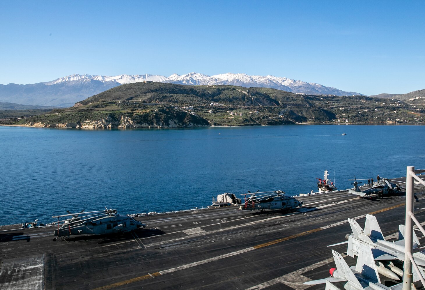 (March 10, 2023) The Nimitz-class aircraft carrier USS George H.W. Bush (CVN 77), along with the embarked staff of Carrier Strike Group (CSG) 10, arrives in Souda Bay, Crete, for a scheduled port visit March 10, 2023. The George H.W. Bush CSG is on a scheduled deployment in the U.S. Naval Forces Europe area of operations, employed by U.S. Sixth Fleet to defend U.S., allied, and partner interests.