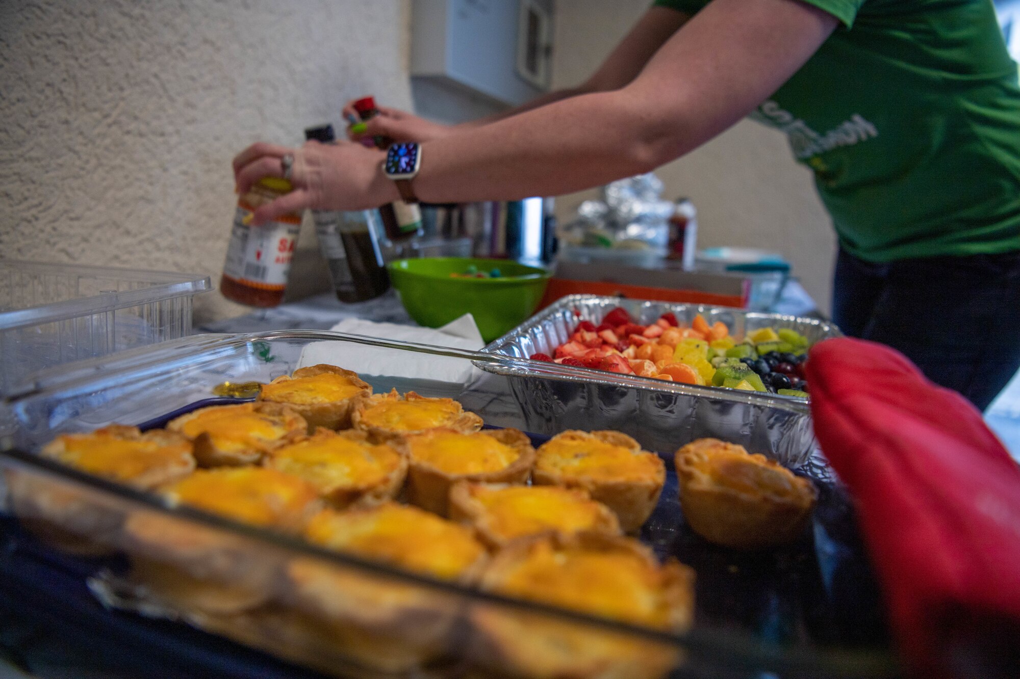 Key spouses from the 76th Airlift Squadron set up a breakfast buffet at Ramstein Air Base, March 6, 2023.