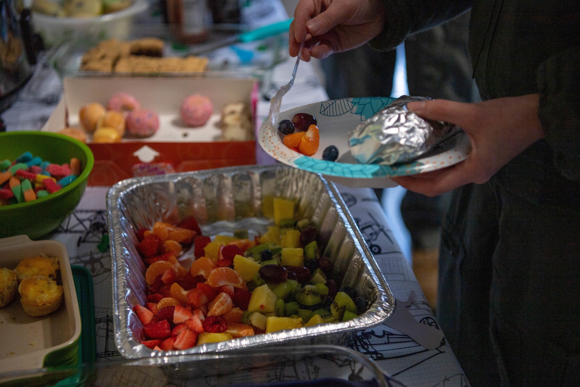 Members of the 76th Airlift Squadron serve themselves breakfast at Ramstein Air Base, March 6, 2023.