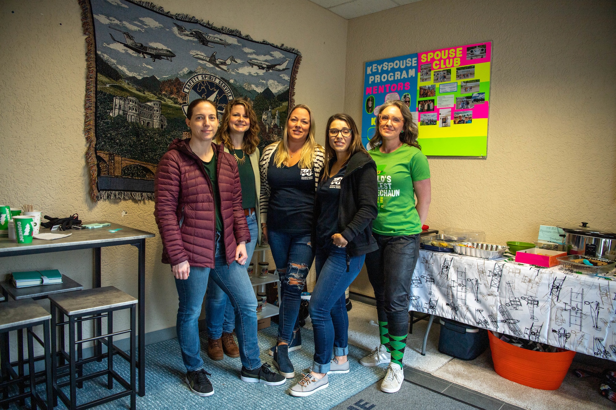 Key spouses from the 76th Airlift Squadron gather for a photo at Ramstein Air Base, March 6, 2023.