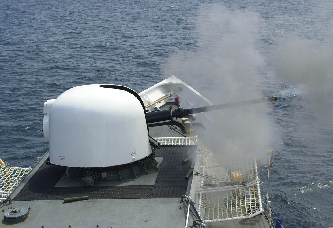 The 76mm gun aboard the Coast Guard Cutter Gallatin fires a three-round burst during a live-fire exercise off the coast of Mayport, Fla., April 26, 2005.