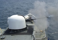 The 76mm gun aboard the Coast Guard Cutter Gallatin fires a three-round burst during a live-fire exercise off the coast of Mayport, Fla., April 26, 2005.