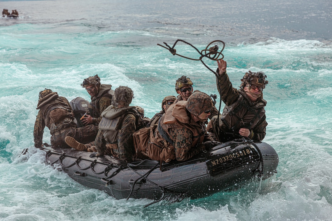 U.S. Marines with Battalion Landing Team 1/4, 31st Marine Expeditionary Unit, prepare to recover their combat rubber raiding craft on to the amphibious transport dock ship USS Green Bay (LPD-20) after a bilateral amphibious assault exercise with soldiers from the 1st Amphibious Rapid Deployment Regiment, Japan Ground Self-Defense Force, at Tokunoshima, Japan, March 3, 2023. The bilateral amphibious assault exercise allowed Marines and JGSDF soldiers to simultaneously secure austere terrain during Iron Fist 23. Iron Fist is an annual bi-lateral exercise designed to increase interoperability and strengthen the relationships between the U.S. Marine Corps, the U.S. Navy, the Japan Ground Self-Defense Force, and the Japan Maritime Self-Defense Force.