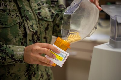 Pharmacy technician fills prescription
