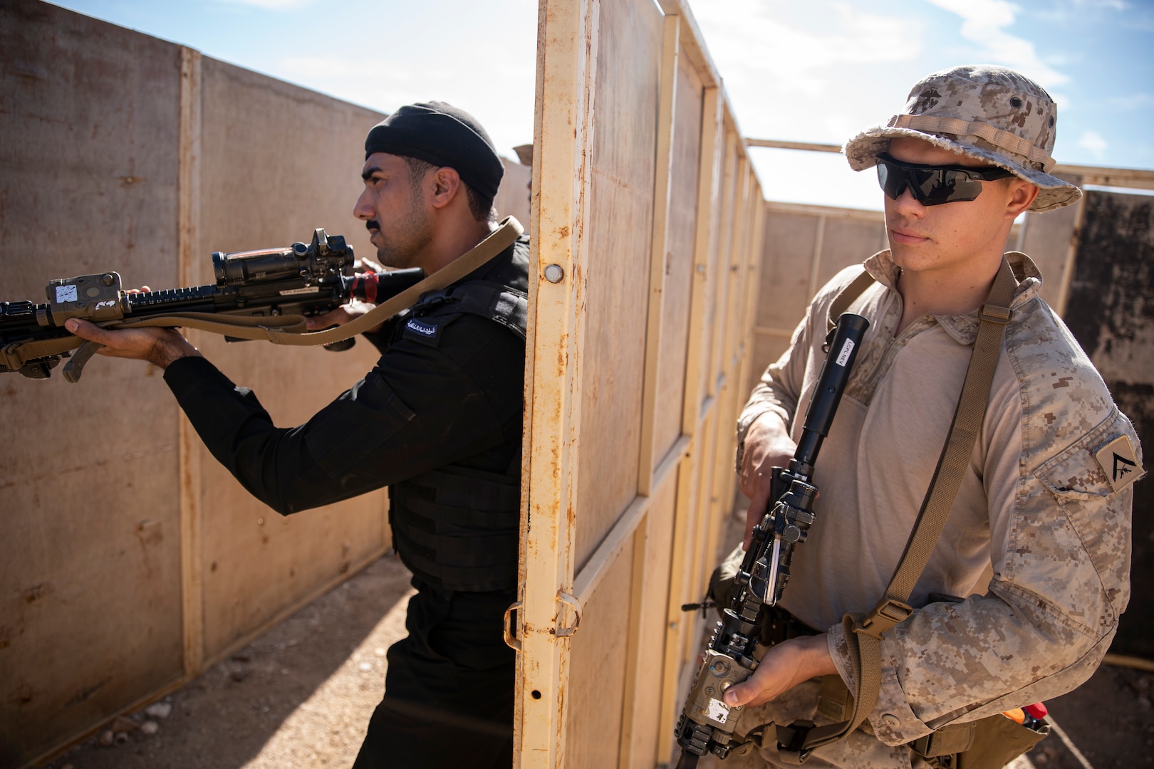 OMAN (February 18, 2023) – U.S. Marines assigned to Fleet Anti-Terrorism Security Team Central Command (FASTCENT) and members of the Royal Omani Police Special Task unit practice clearing rooms during close quarter combat (CQB) training as part of exercise Invincible Sentry 23 in Oman, Feb 18. IS23 is a recurring exercise held with different partner nations each year within U.S. Central Command’s area of responsibility to evaluate the readiness and capabilities of U.S. and Omani forces responding to a regional emergency. (U.S. Marine Corps photo by Staff Sgt. Benjamin McDonald)