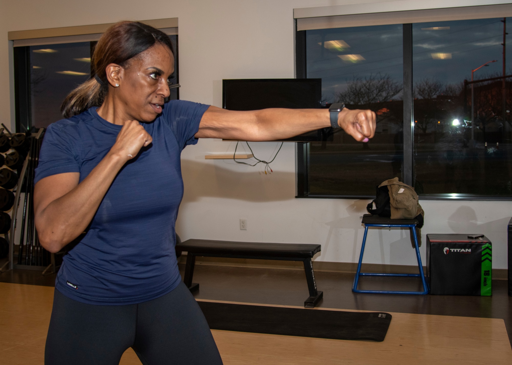 Tech. Sgt. Katrina White, 512th Airlift Wing inspections coordinator, demonstrates a jab on Dover Air Force Base, Delaware, Jan. 7, 2023. White plans to conduct fitness classes over the unit training assemblies. (U.S. Air Force photo by Senior Airman Shayna Hodge)