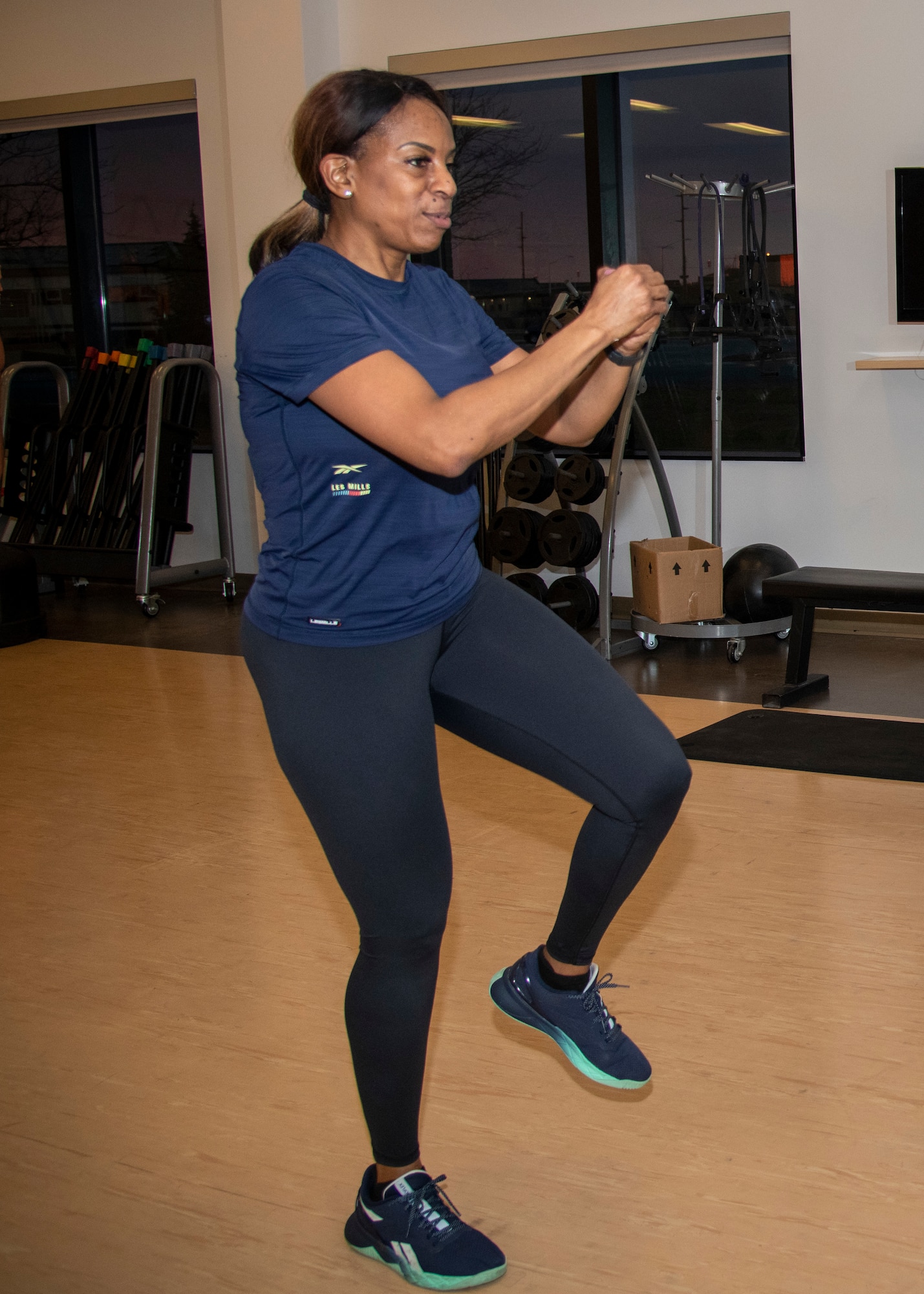 Tech. Sgt. Katrina White, 512th Airlift Wing inspections coordinator, exercises at the fitness center on Dover Air Force Base, Delaware, Jan. 7, 2023. White was certified as a group fitness instructor in January 2020 and now teaches dance-style and bootcamp fitness classes. (U.S. Air Force photo by Senior Airman Shayna Hodge)
