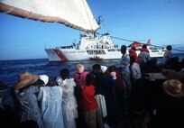 The U.S. Coast Guard cutter Courageous (WMEC 622) prepare to board a vessel carrying Haitian migrants.