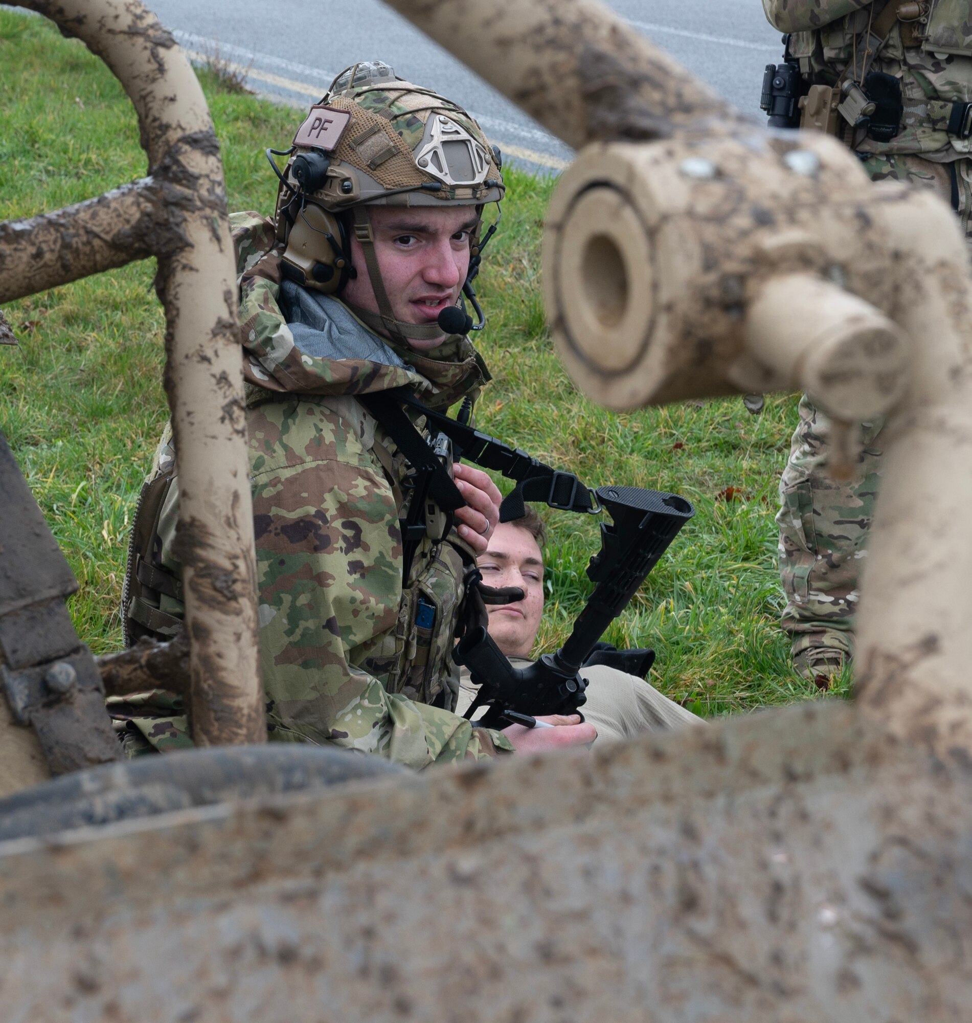 U.S. Air Force Staff Sgt. Tyler Karr, 435th Contingency Response Squadron team chief, provides Tactical Combat Casualty Care (TCCC) techniques on an individual with simulated life-threatening injuries sustained in a scenario-based vehicle rollover accident during Exercise Agile Bison at Chièvres Air Base, Belgium, March 9, 2023.