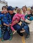 U.S. Coast Guard Petty Officer 1st Class Patrick Bianchi's family greets him at the cutter's return to home port March 10, 2023, in Portsmouth, Virginia. Spencer returned home following an 88-day deployment in the U.S. Naval Forces Europe-Africa area of operations, employed by the U.S. Sixth Fleet and Combined Task Force 65, to defend U.S., allied and partner interests. (U.S. Coast Guard photo by Petty Officer 3rd Class Kate Kilroy)