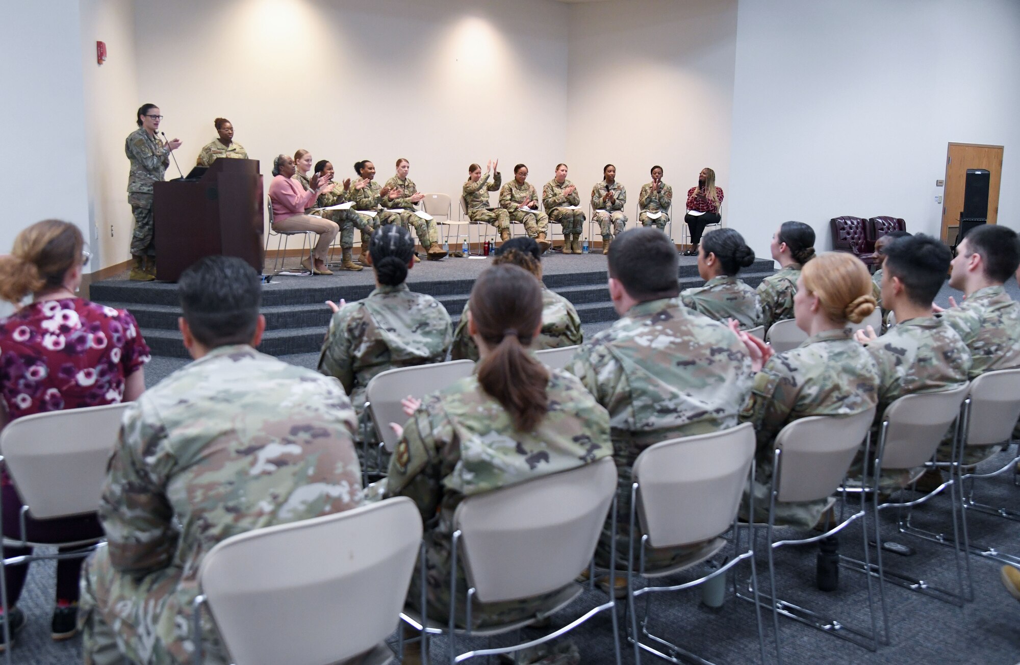 Keesler personnel attend the Women's History Month Diversity and Inclusion Panel inside the Roberts Consolidated Aircraft Maintenance Facility at Keesler Air Force Base, Mississippi, March 10, 2023.