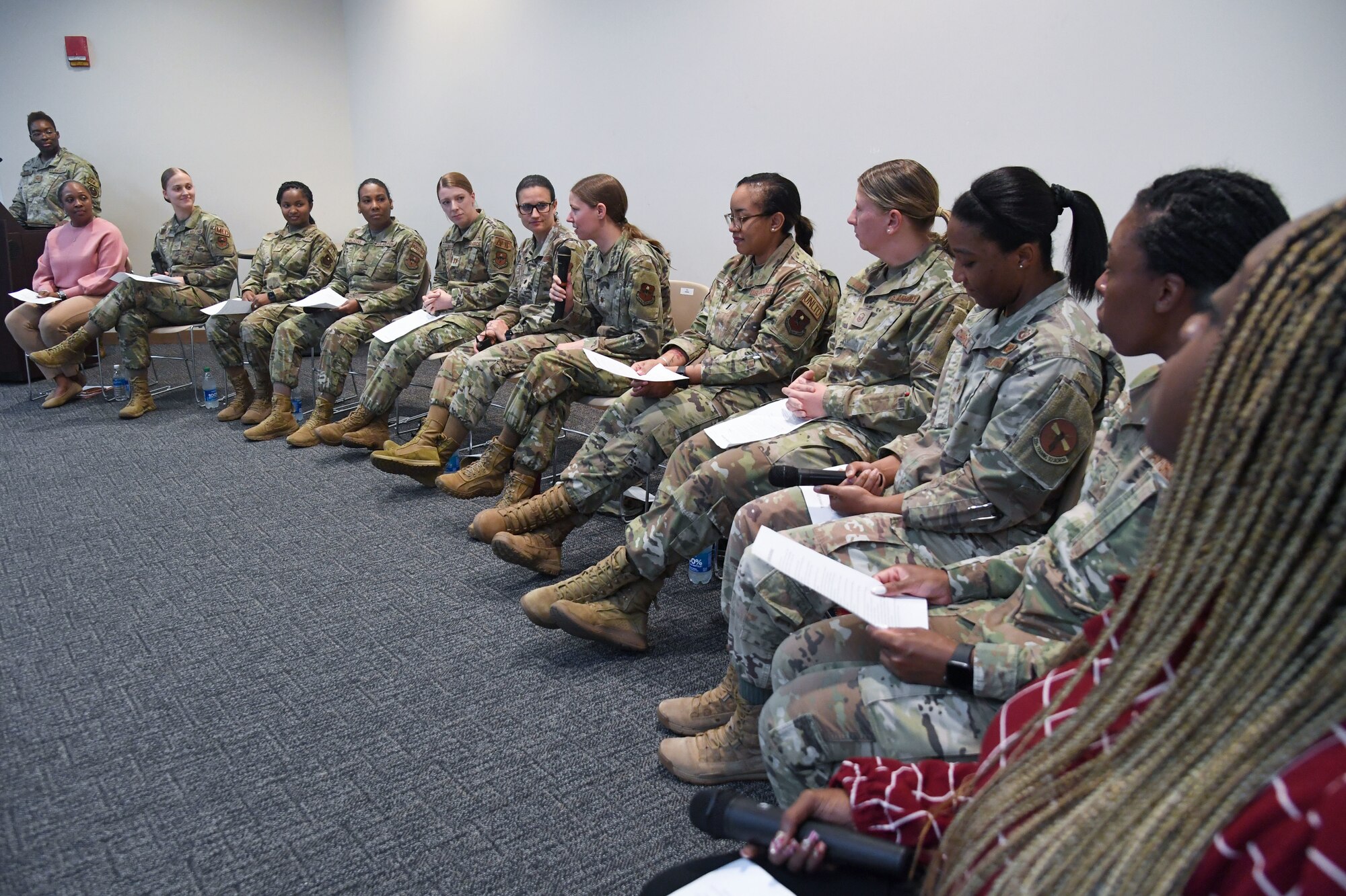 Keesler personnel participate in the Women's History Month Diversity and Inclusion Panel inside the Roberts Consolidated Aircraft Maintenance Facility at Keesler Air Force Base, Mississippi, March 10, 2023.