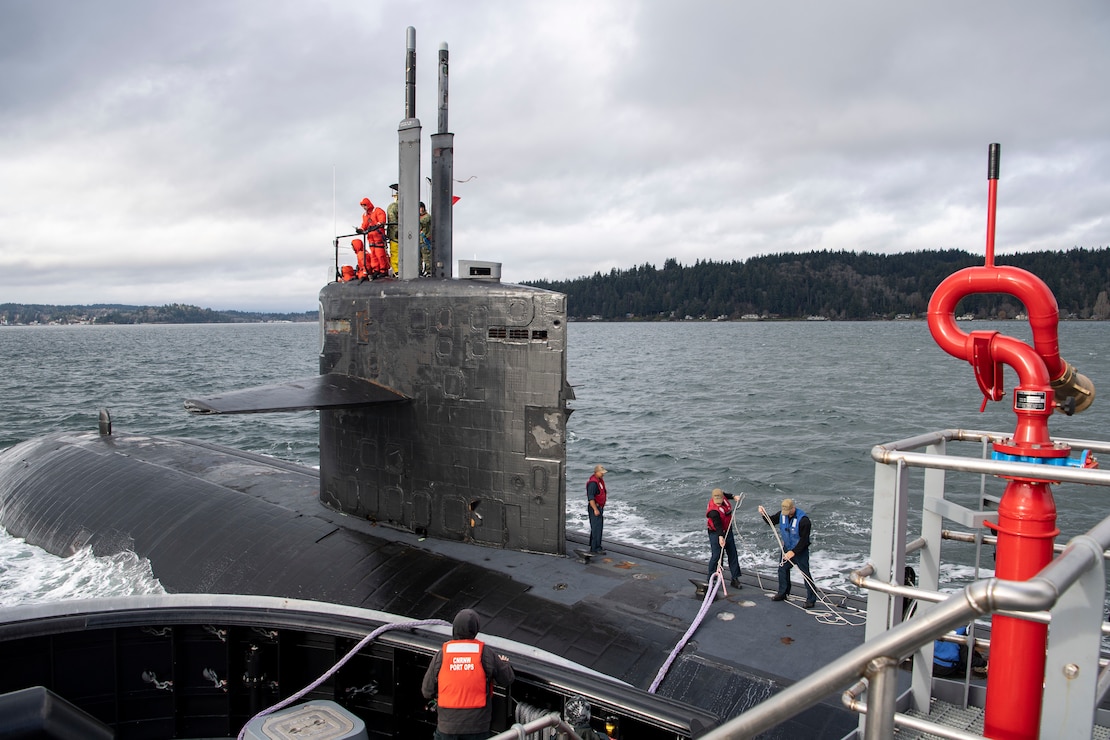 Sailors work aboard the Los Angeles-class fast-attack submarine USS Chicago (SSN 721) as the vessel transits the Puget Sound to its new homeport of Naval Base Kitsap-Bremerton, Washington, Jan. 17, 2023. Chicago, the fourth U.S. Navy ship to be named for the Illinois city, is scheduled to begin the inactivation and decommissioning process at Puget Sound Naval Shipyard after 36 years of service. (U.S. Navy photo by Mass Communication Seaman Sophia H. Brooks)