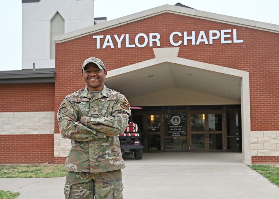 U.S. Air Force Airman 1st Class Joshua Knight, 17th Training Wing religious affairs Airman, stands in front of Taylor Chapel, Goodfellow Air Force Base, Texas, Mar. 8, 2023. Religious Affairs Airmen work closely with base Chaplains to support spiritual fitness as one of the four pillars of fitness. (U.S. Air Force photo by Airman 1st Class Zachary Heimbuch)