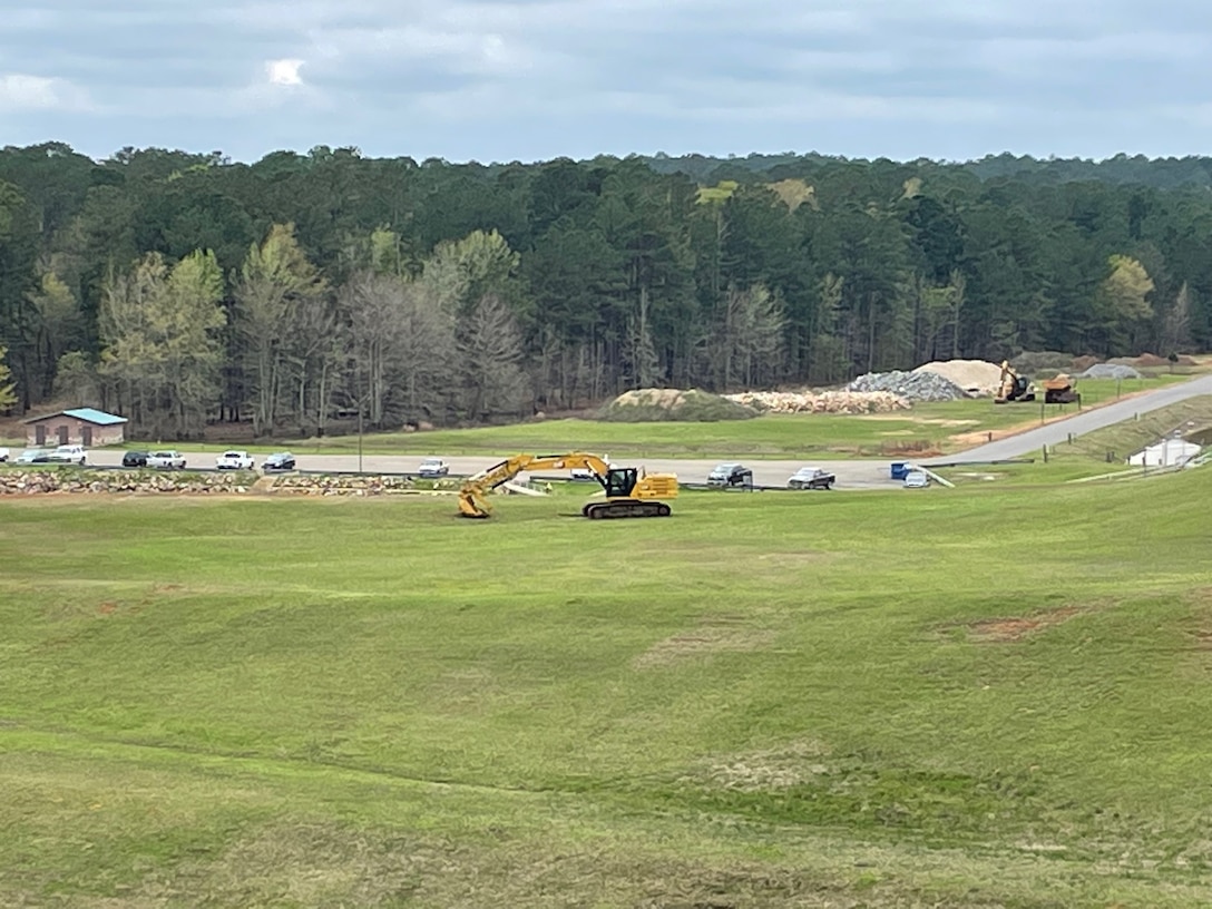 Prepositioned construction equipment for rip-rap repairs.