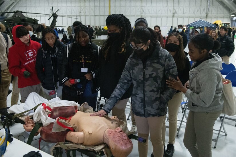 JStudents from Prince George's County, Md., examine a medical test manikin during the Annual Aerospace Summit at Joint Base Andrews, Md., March 9, 2023. The summit featured 14 Science, Technology, Engineering, Arts and Math related workshops for the students to experience. (U.S. Air Force photo by Senior Airman Daekwon Stith)