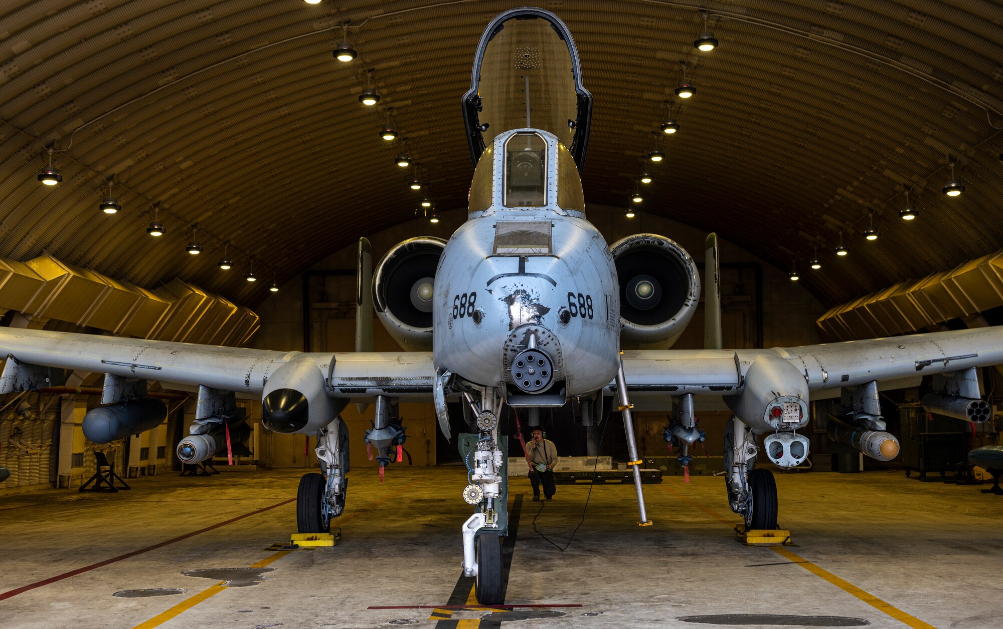U.S. Air Force Airman 1st Class Timothy Gisclair, 25th Fighter Generation Squadron crew chief, performs pre-flight checks on an A-10C Thunderbolt II during Buddy Squadron 23-2 at Osan Air Base, Republic of Korea, March 8, 2023.