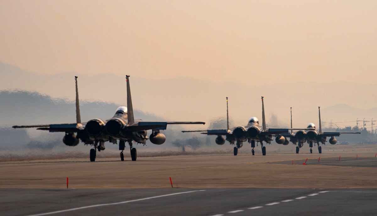 Three Republic of Korea F-15K Slam Eagles assigned to the 102nd Fighter Squadron, taxi on the runway before flight during Buddy Squadron 23-2 at Osan Air Base, Republic of Korea, March 8, 2023.