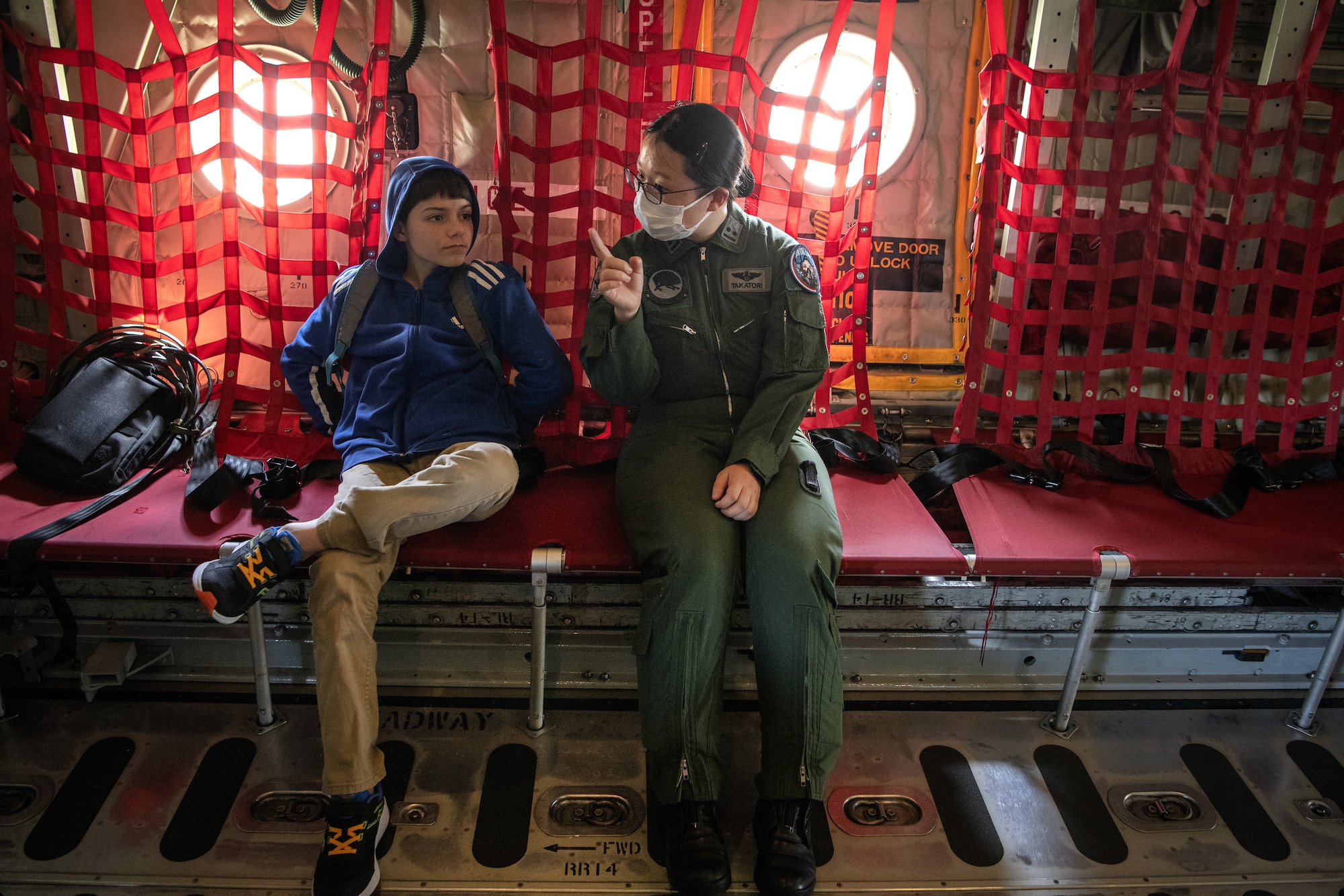 Japan Air Self-Defense Force 1st Lt. Ayane Takatori talks to a student about aviation during a ‘Fly Girls’ aviation event.