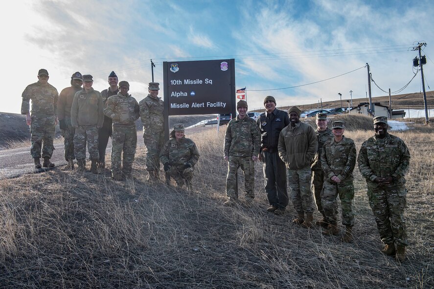 Malmstrom AFB and USAFSAM members pose for a photo outside a missile launch facility